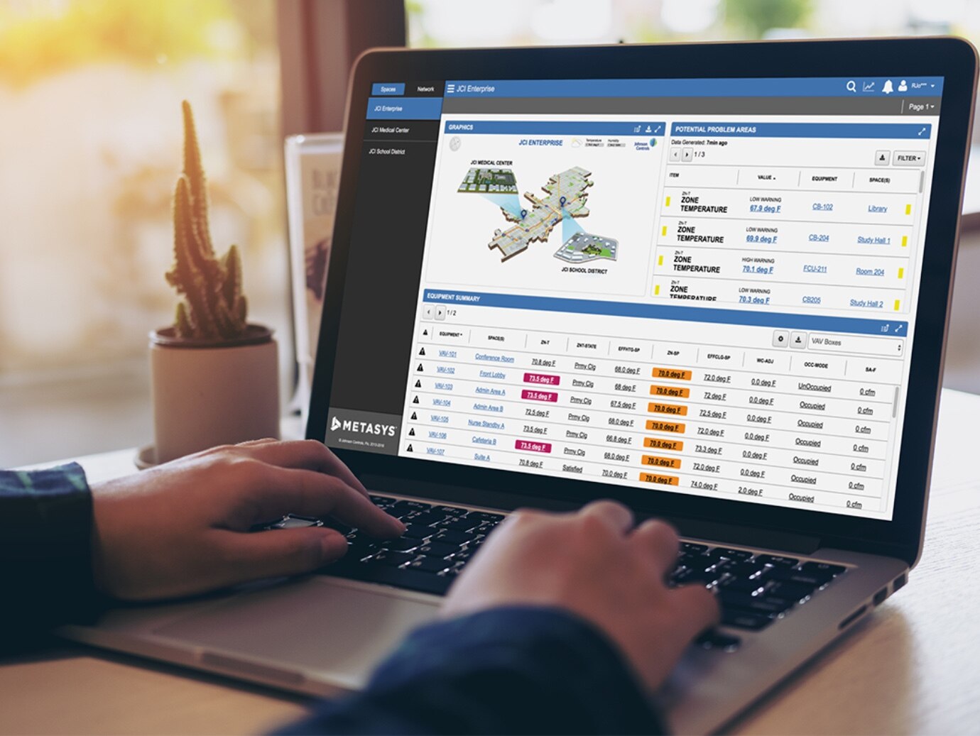 A person looking at the Metasys software on their laptop